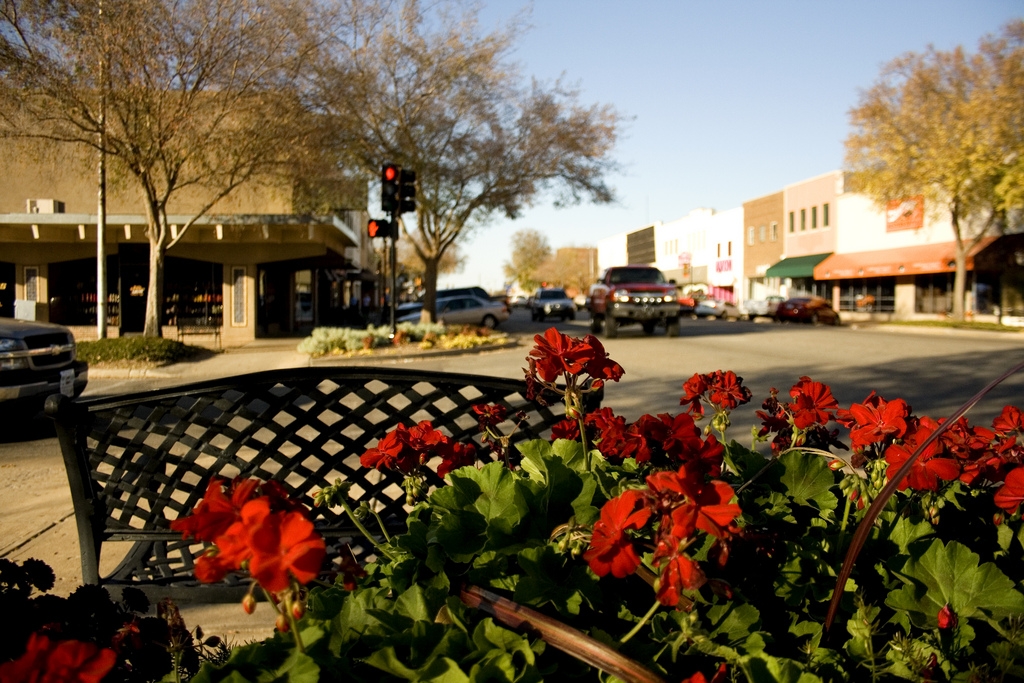 Flowers and storefronts at Eighth and Main in downtown Stillwater
